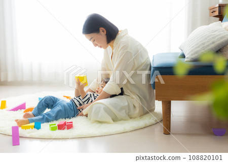 A mother holding a child 108820101