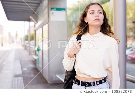 Portrait of a confident girl standing at a stop Portrait of a confident girl standing at a stop 108822078