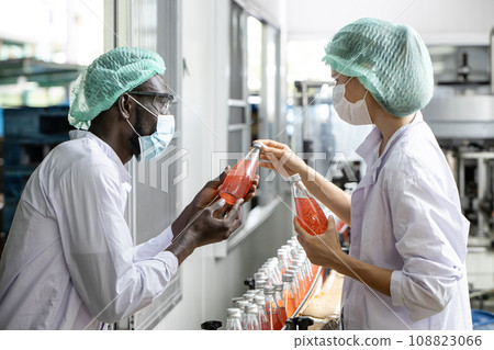 Drink beverage factory QC audit staff quality control worker team working. Hygiene officer clean standard check process inspection in plant production line. 108823066