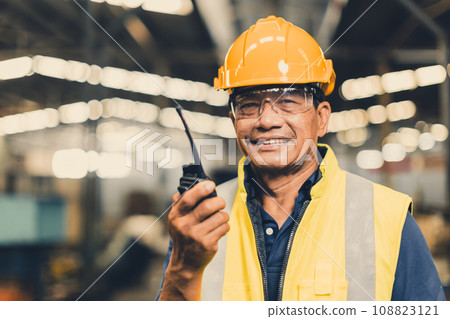 portrait happy senior Asian engineer worker staff working radio operate team in heavy industry metal factory 108823121