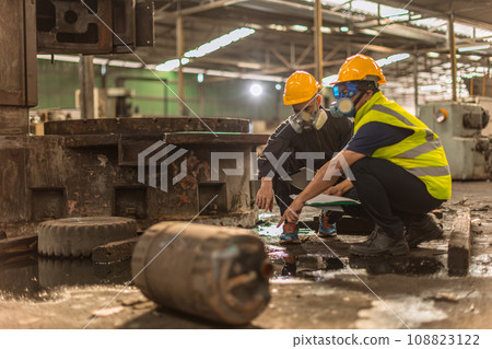 Chemical toxic liquid dirty oil leak danger to environment impacts investigation team working site rescue and examination with safety 108823122