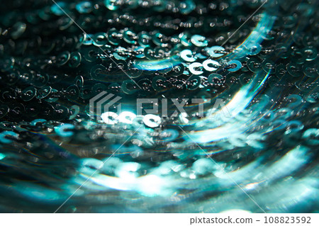 Christmas abstract background made of emerald green sequins. Christmas abstract background made of emerald green sequins. 108823592