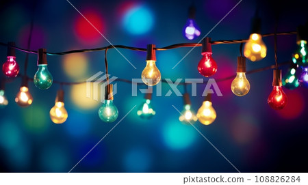 Christmas lights with bokeh effect on dark background. 108826284