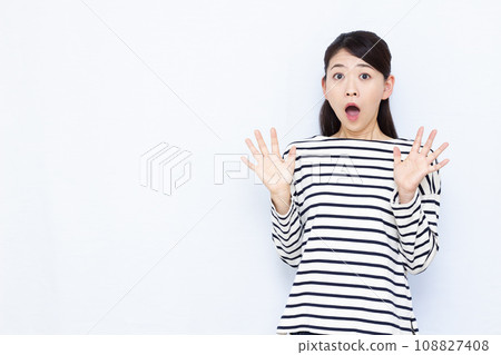 Surprised woman in her 40s Surprised woman in her 40s 108827408