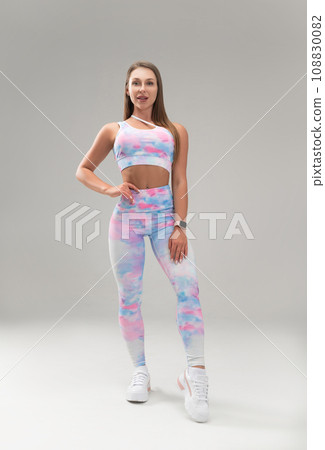 sexy athletic girl in a tight fitness tracksuit on a light background copy paste in the studio sexy athletic girl in a tight fitness tracksuit on a light background copy paste in the studio 108830082