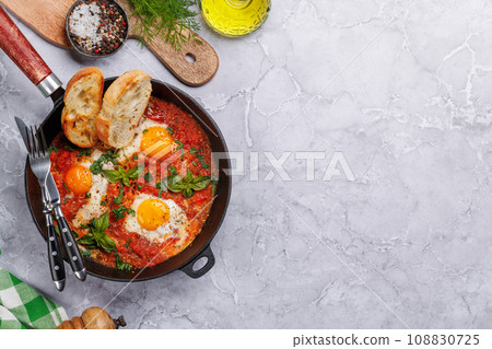 Delicious shakshuka breakfast in a pan Delicious shakshuka breakfast in a pan 108830725
