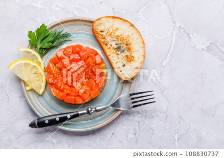 Delicious salmon and avocado tartare Delicious salmon and avocado tartare 108830737