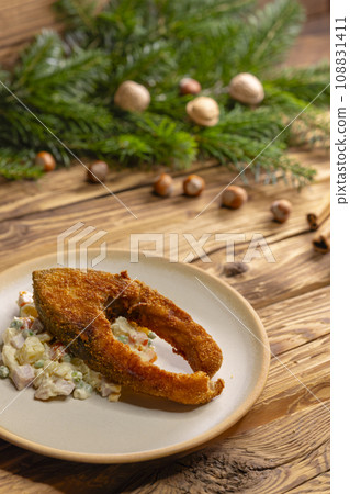 Traditional Christmas dinner in Czech Republic - fried carp with potato salad 108831411