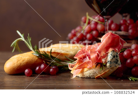 Delicious snack and glasses of red wine. 108832524