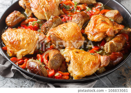 Chicken scarpariello or shoemakers chicken, is a classic Italian-American dish of chicken, sausage, vinegar, onions and peppers closeup on the plate. Horizontal Chicken scarpariello or shoemakers chicken, is a classic Italian-American dish of chicken, sausage, vinegar, onions and peppers closeup on the plate. Horizontal 108833081