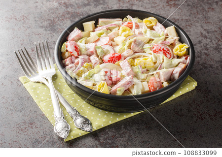 Italian Grinder Salad combines all the ingredients of an famous sub sandwich closeup on the plate. Horizontal 108833099