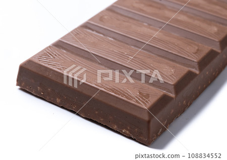 Traditional pieces of delicious Christmas chocolate nougat isolated on white background 108834552