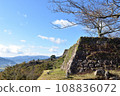 The stone walls of Takeda Castle ruins shine against the blue sky 108836072