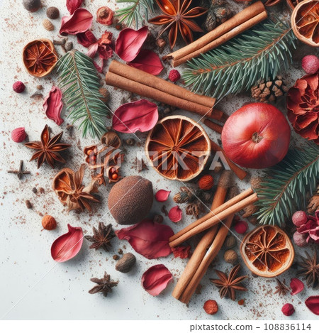 Christmas greeting card from scattered spruce twigs, red dry petals of fruit tree, golden fruits 108836114