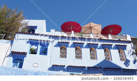 Mansion with umbrellas in African Chefchaouen city in Morocco Mansion with umbrellas in African Chefchaouen city in Morocco 108836465