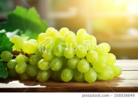 Fresh green grapes on wooden table. Organic and healthy fruit Fresh green grapes on wooden table. Organic and healthy fruit 108836649
