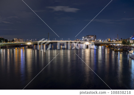 Evening view of the Deutz Bridge in Cologne, lights reflected in the Rhine 108838218