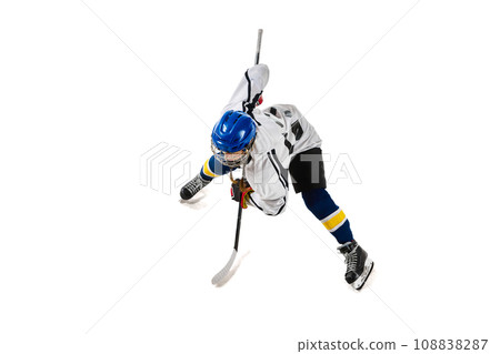 Top view image of young girl, hockey player in motion during game, training, playing isolated over white background Top view image of young girl, hockey player in motion during game, training, playing isolated over white background 108838287