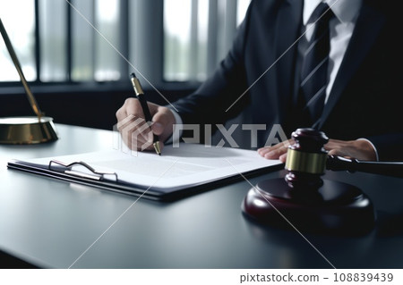 Cropped photo of a lawyer signing documents in court. Cropped photo of a lawyer signing documents in court. 108839439
