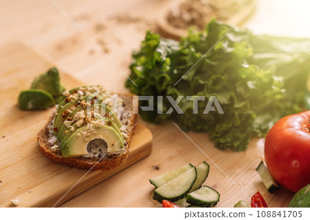 Fresh vegetables in white plates and on a wooden table Fresh vegetables in white plates and on a wooden table 108841705