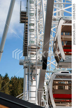 Big tall white ferris wheel in front of perfect blue sky in Bukovel. Carpathians Ukraine 108842685