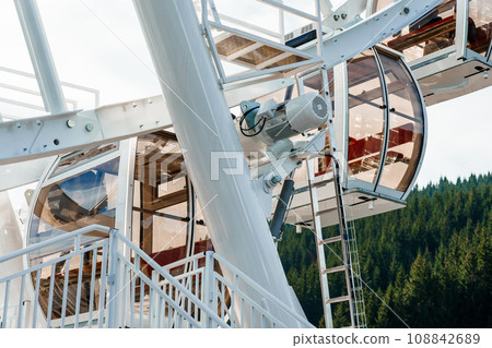 Big tall white ferris wheel in front of perfect blue sky in Bukovel. Carpathians Ukraine 108842689