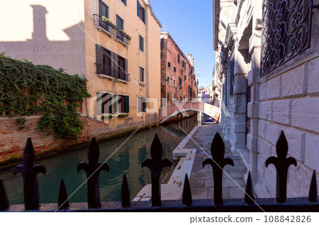 Venice. Old stone traditional houses over the canal. 108842826