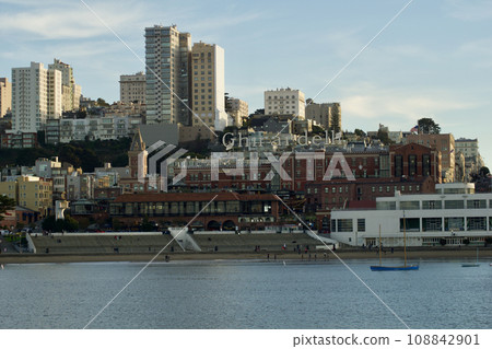 SAN FRANCISCO, CALIFORNIA, UNITED STATES - NOVEMBER 26, 2018: View of downtown San Francisco from the water with the piers in the foreground SAN FRANCISCO, CALIFORNIA, UNITED STATES - NOVEMBER 26, 2018: View of downtown San Francisco from the water with the piers in the foreground 108842901