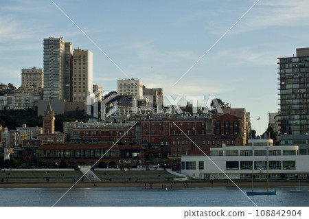 SAN FRANCISCO, CALIFORNIA, UNITED STATES - NOVEMBER 26, 2018: View of downtown San Francisco from the water with the piers in the foreground 108842904