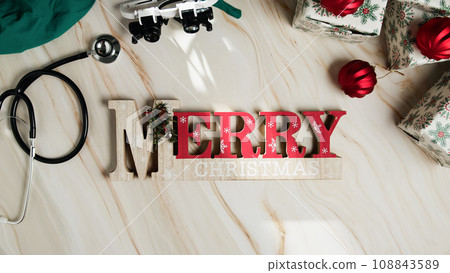 Merry Christmas sign with medical instruments flat background  108843589