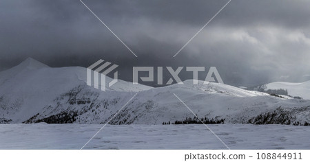 Winter mountain view in Carpathian mountains with dramatic clouds 108844911