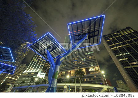 Urban street neon illumination with solar photovoltaic panels for power supply of streetlights and surveillance cameras. Futuristic energy source in downtown Miami, Florida 108845092