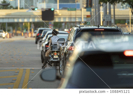 Traffic lights regulating driving cars on city street in Miami, Florida Traffic lights regulating driving cars on city street in Miami, Florida 108845121