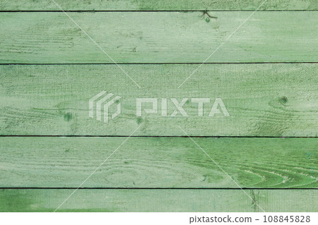 Natural weathered wooden planks background. Old painted in green boards panels Natural weathered wooden planks background. Old painted in green boards panels 108845828