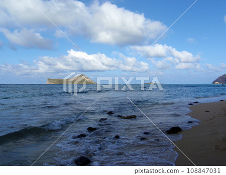 Waves lap on rocky shore of Waimanalo Beach Waves lap on rocky shore of Waimanalo Beach 108847031