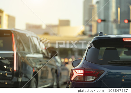 Cars traffic driving at intersection on American street with traffic lights in Miami, Florida. USA transportation Cars traffic driving at intersection on American street with traffic lights in Miami, Florida. USA transportation 108847387