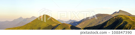 Carpathian mountain landscape in summer. Panoramic view. Sunset in Ukraine mountains. Wide panorama. 108847390