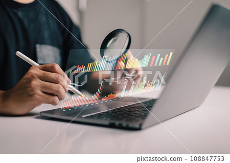 The CEO, acting as a one-man public relations team, is diligently studying market research and financial figures, determined to break through the ceiling of success. 108847753