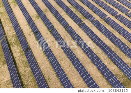 Aerial view of solar power plant. Electric panels for producing clean ecologic energy. Aerial view of solar power plant. Electric panels for producing clean ecologic energy. 108848115