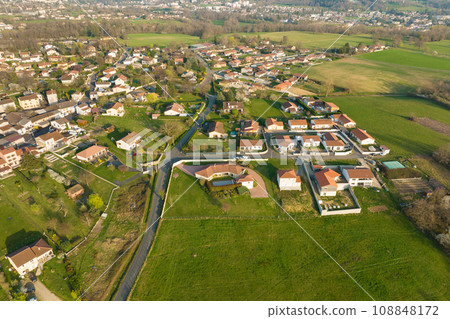 Aerial view of residential houses in green suburban rural area 108848172