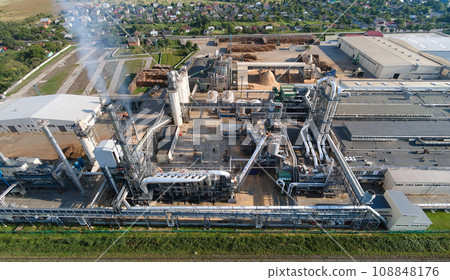Aerial view of oil and gas refining petrochemical factory with tall refinery plant manufacture structure. 108848176