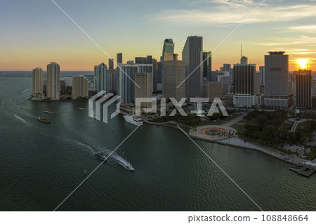 Aerial view of downtown district of of Miami Brickell in Florida, USA at sunset. High commercial and residential skyscraper buildings in modern american megapolis 108848664