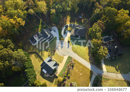 Aerial view of classical american homes in South Carolina residential area. New family houses as example of real estate development in USA suburbs Aerial view of classical american homes in South Carolina residential area. New family houses as example of real estate development in USA suburbs 108848677