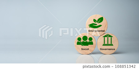 ESG concepts for sustainable environment, society and governance Businesses are environmentally responsible. A  wooden circular board with the abbreviation ESG printed on a white background. 108851342