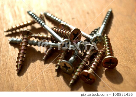 many screws on the desk 108851436