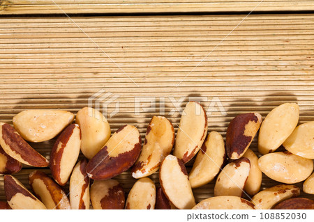 Brazil nuts on wooden background Brazil nuts on wooden background 108852030