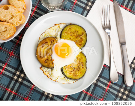 Appetizing fried eggs made with eggplants Appetizing fried eggs made with eggplants 108852036