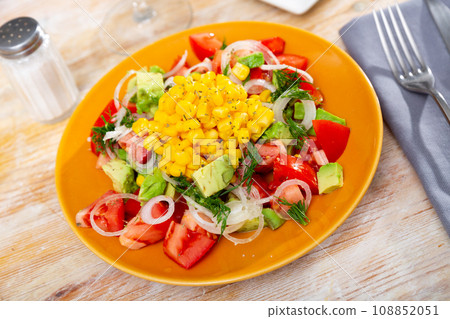 Salad with avocado, corn and tomato 108852051
