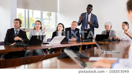 Group of business people discussing work plan in conference room Group of business people discussing work plan in conference room 108853049