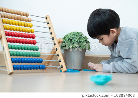 Asian boy having fun playing slam on the floor Learning outside the classroom 108854008